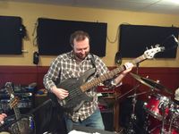 Sam Hallam on bass