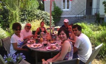 Leslie & Gerard enjoy a meal w/ Sima & Tim's family in La Baule, France.
