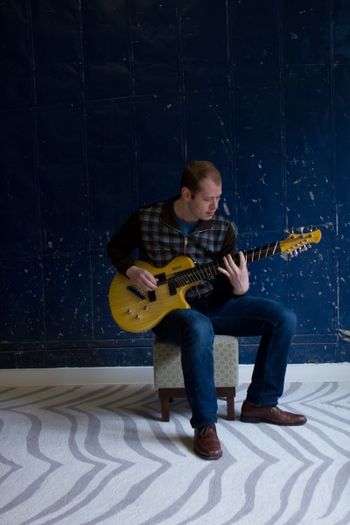 Ben, Guitar, And Blue Wall
