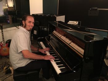 Playing the Bosendorfer upright at 45 sound while recording Ben Sharkey's "Mercury CD"

