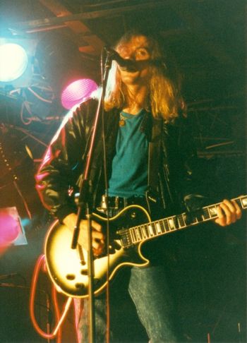 Chris - lead guitar, lead vox on stage circa 89'
