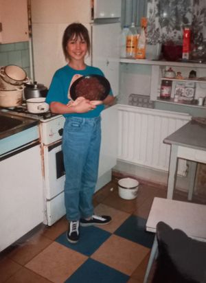 Kid cooks first meat loaf in small Russian kitchen