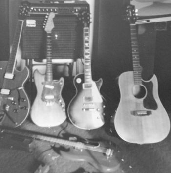 Early 1980s guitar collection. Austin, TX. Traded in the 3/4 size Fender (2nd from right) and must have sold or traded the Gibson SG bass on the floor, but I still have the others.
