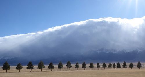 Sangre de Cristos covered in white clouds and blue sky