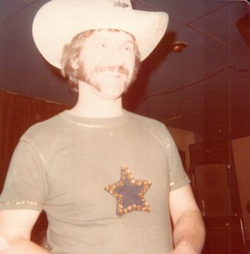 He really was born in Texas Who else would put gold trim and a jeweled star on a t-shirt?
