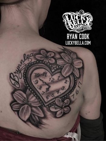 Time Piece and Flowers by Ryan Cook at Lucky Bella Tattoos in North Little Rock, Arkansas
