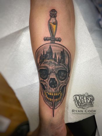 Skull and Hogwarts Tattoo by Ryan Cook at Lucky Bella Tattoos in North Little Rock, AR
