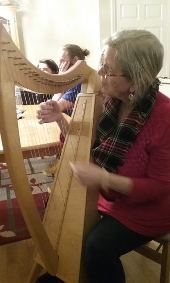 Sheila Burke with Irish harp, Christmas gathering - Dearborn Michigan
