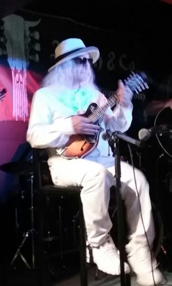 Joe Kidd on stage with mandolin in Windsor Ontario Canada
