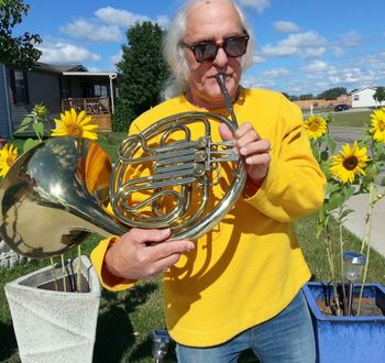 Joe Kidd with French Horn in Sunflower Garden
