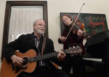 Larry and Sandra playing in their music room photo courtesy Charleston Gazette Mail

