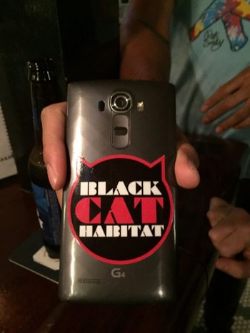 Black Cat Habitat Sticker on Phone
