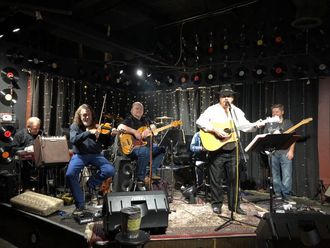 Jimmy and his band playing for the Induction Ceremony Show held at the Music City Bar and Grill in Nashville. L-R: Billy Easton on steel, Hyram Posey on Fiddle, Kevin Cathey on drums, Roger Lewis on bass, Jimmy singing, Jamie Bowles on keyboards, and Lonnie Skahl on lead guitar. 