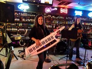 Sandy playing her Keytar at The Ivy Tavern
