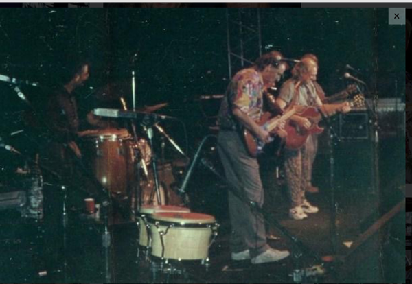 The two young guitar players on stage here are Me & Jimmy Buffett.
Mark Rutledge on congas. 
Not shown in this photo but on stage; Tim Flannery and Shaaron Hancock Schuemaker. 

The original Buff’d Out Band.

San Diego Convention Center
 Nov 6, 1992

————————————————————
