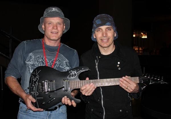 Sir Satch and me wIth my favourite six string electric which i use to plaY slide in standard tuning ... note the 'd00dles' by Satch oN mY guitar ... we were playin' that night, with tHe Mountain man hImself ... Sir Leslie West ...   
