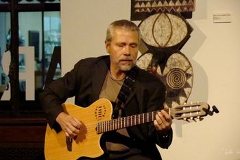Playing a Godin Multiac Nylon string at The Arts Exchange in White Plains, NY.This is the same guitar used on the "Alone But Not Alone" CD
