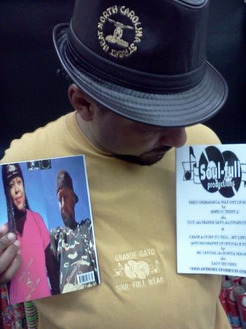 GRANDE GATO aka SUPAFLYY PREEST aka J.O.T. holding up 2012 book PRESS ON(MAKING A WAY OUT OF NO WAY)!!!!
