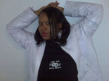 MS. CRYSTAL wearing 2010 Black LADY SOUL with white SOUL-FULL logo.  Also wearing white leather jacket over it and black & white Nike Air Force One tennis shoes.

