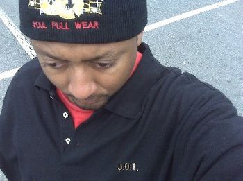 J.O.T. in BLACK polo style SOUL-FULL WEAR shirt with name on front
