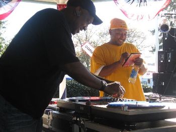 J.O.T. aka GRANDE GATO holding DVD & BLACKSMITH DJ aka DARYL YOUNG getting DJ equipment ready for their 2009 DIXIE CLASSiC FAIR performance.
