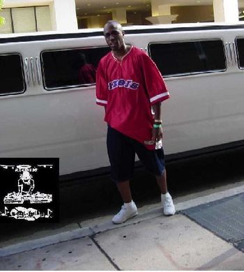 CHRISTAIN rapper CHANCE standing in front of J.O.T. aka GRANDE GATO's Stretch HUMMER limo at 2004 UMOJA FESTIVAL(MIAMI, FL)
