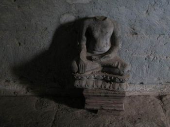 Buddha without head in Angkor Wat.
