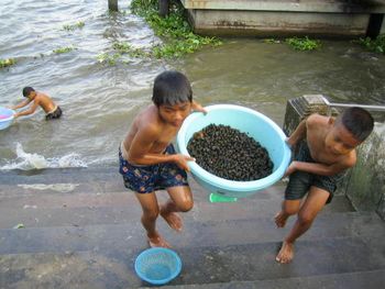 Hauling in the snails. Yummie!? Bangkok, Thailand.
