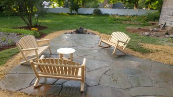 Irregular bluestone (full color) patio with built in firepit.
