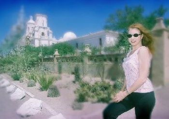 One of the many things we enjoy to do across the country while on tour is find old ghost towns or missions to photograph. Here Bethany is posing in front of the San Xavier Mission built in 1700 just S
