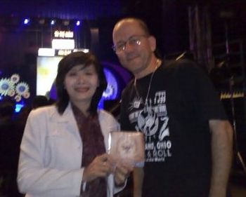 Presenting Ms. Nguyen Thi Hue of the Red Cross with the Rock in Asia CD

