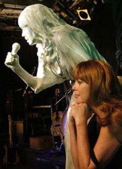 Another shot by Hamo Djoboulian captured Lynne in a quiet moment with her statue on the stage at the Roxy Nightclub in Vancouver, Canada, during a break in the filming of the live scenes in the "Turn
