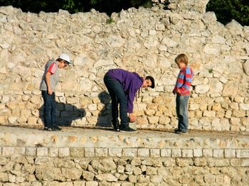 Children play on Roman ruins, Nice, France
