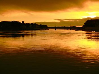 Shot of the Rhone River at dusk in Arles, France.
