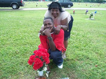 Linda and her son Travis visiting our father's grave - The late Rev. Willie Bell
