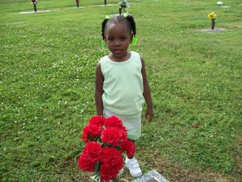 Miss MeMe visiting her great grandfathers grave "The Late Rev. Willie Lee Bell"
