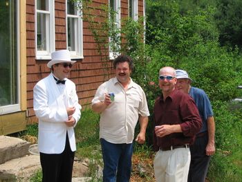 Laughter fills the door yard. Jon, Joe, Mitch and Grampa White (sneaking up on the young fellers) at the farm 2005.
