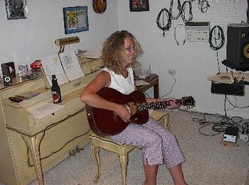 Melissa Bauer (The Garritys) playing guitar in the studio (she assured me that the bottle on the piano is root beer)
