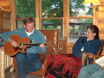 Back to H&W; here's hit-songwriter Rory Lee playing while his wife, Joey, looks on

