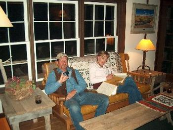 John Bogosh and Jenny Foley relaxing in front of the fireplace
