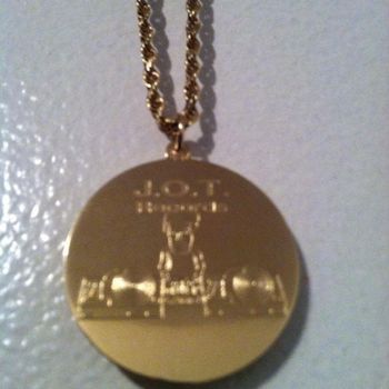 J.O.T. RECORDS solid gold medallian with J.O.T. RECORDS logo engraved hanging from solid gold rope chain!!!!
