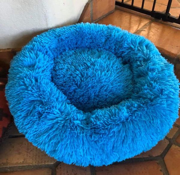This soft snuggy bed serves to give our furry friends comfort. 
