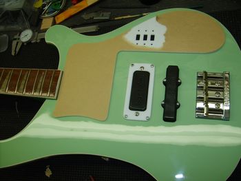 I cut a custom pickguard that closely resembles the original Rickenbacker unit, but will allow the use of a Bartolini neck pickup and custom switches and potentiometers....
