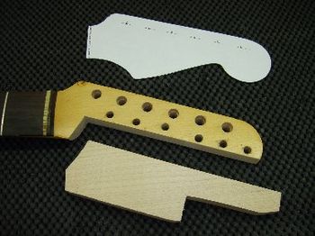 I cut a grain-matched maple splice to fill the gap
