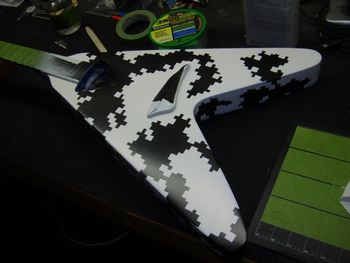 Next, the guitar will be masked for a third camo color.....
