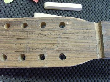 This Martin 12-string suffered a broken headstock.  Here, I have glued it back together, and am preparing to reinforce the repair.

