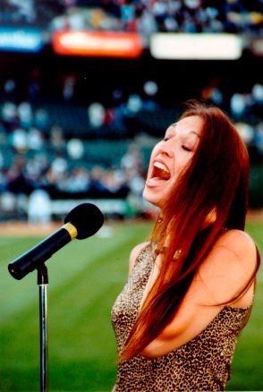Singer/Songwriter Kimberlee M. Leber singing the National Anthem for the San Francisco Giants at Oracle Park Stadium