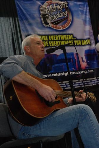 Performing at the Midnight Trucking Radio booth.
