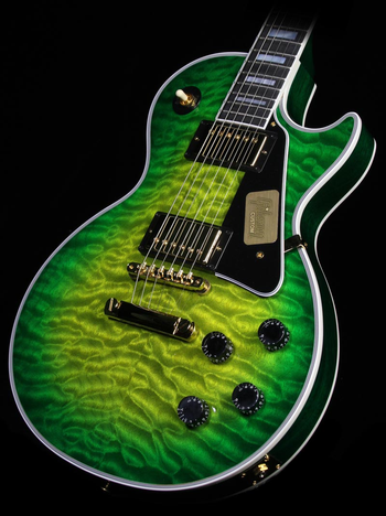 Jeff's first electric guitar was a sparkle green Framus he acquired while a student at the International School of Geneva, Switzerland.  He still has the guitar, but the green sparkle veneer separated from the guitar's body long ago, leaving Jeff without a green guitar.  Clearly, this was an intolerable situation.  This Gibson Les Paul Custom, in an unusual Iguanaburst finish, is the spiritual successor to that Framus.  From Gibson's Custom Shop, it features a quilted maple top and CustomBucker pickups, along with a split-diamond headstock inlay.
