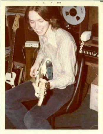 Jeff plays guitar while preparing for One In Versailles in early 1975.
